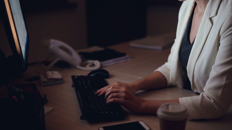 Woman working late at her office desk