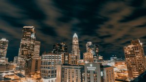 City skyline under gray cloudy sky during daytime