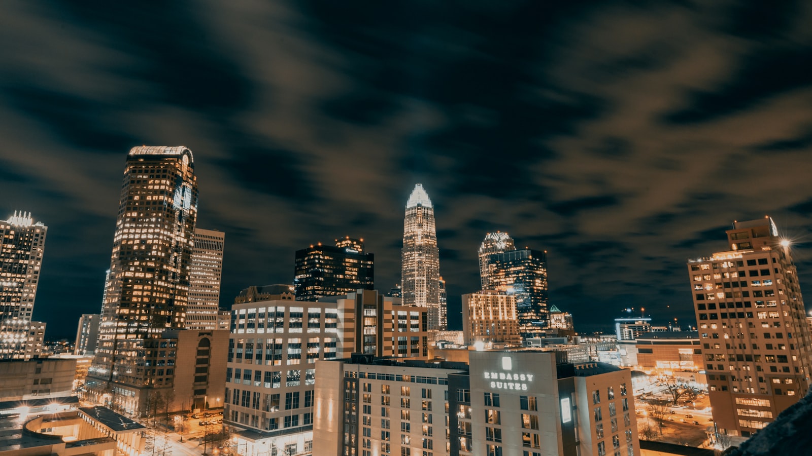 City skyline under gray cloudy sky during daytime
