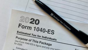 A pen sitting on top of a tax form